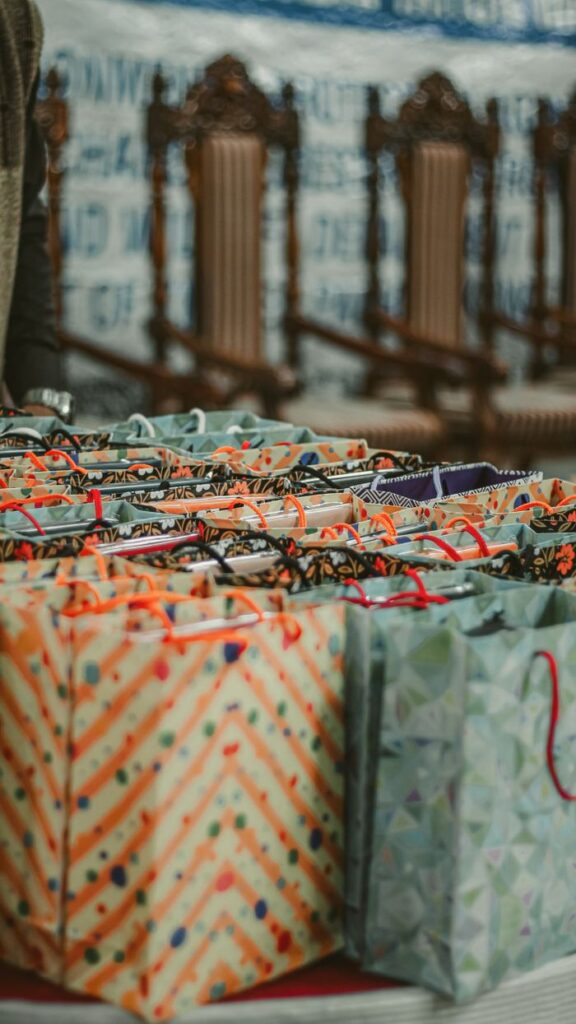 Vibrant and meticulously arranged gift bags displayed indoors, perfect for celebrations.